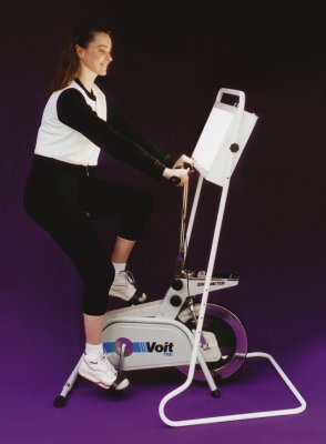[Picture of woman riding exercise bike with Bio-Light bright light therapy system for seasonal affective disorder]
